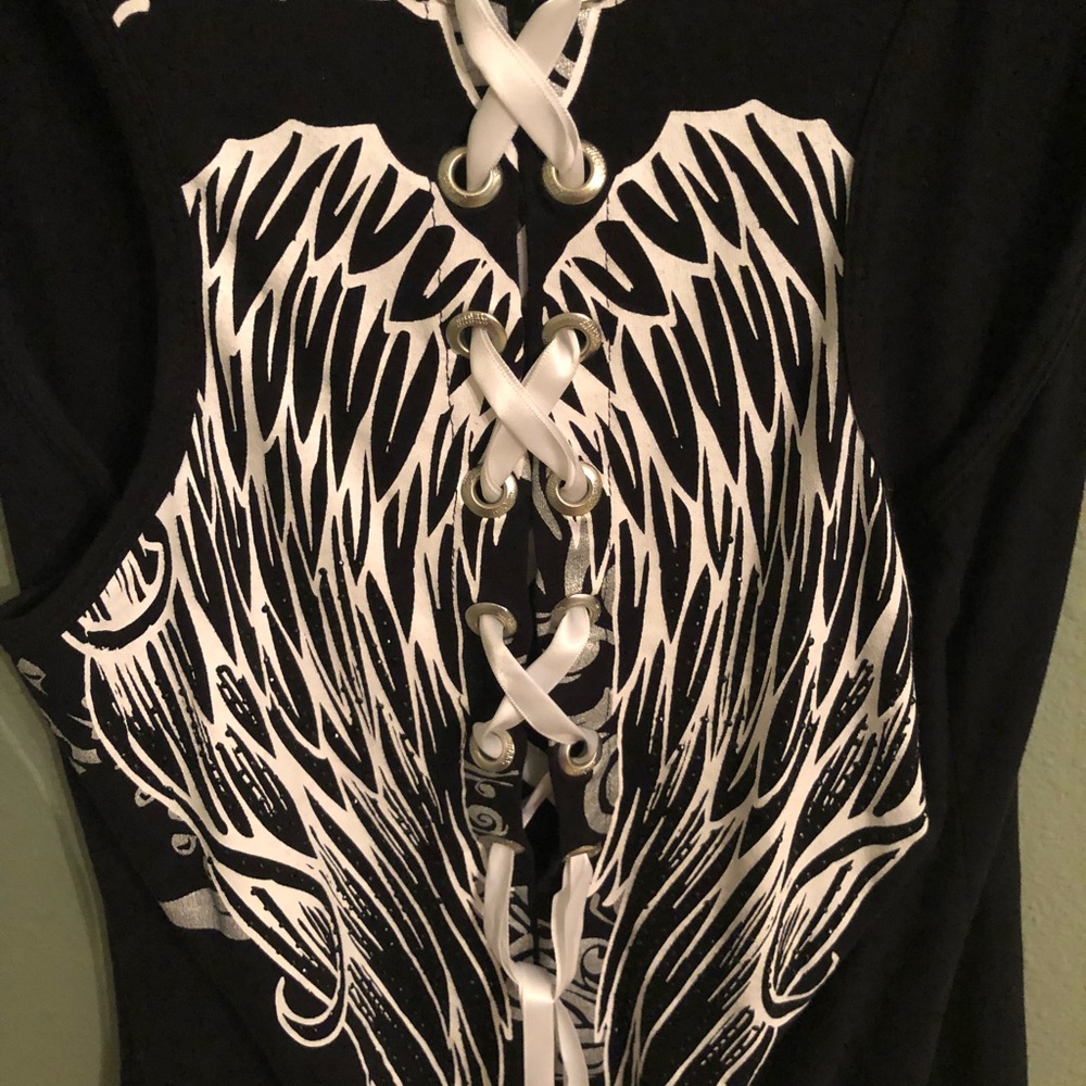 Black tank top with wings detail and lace up back